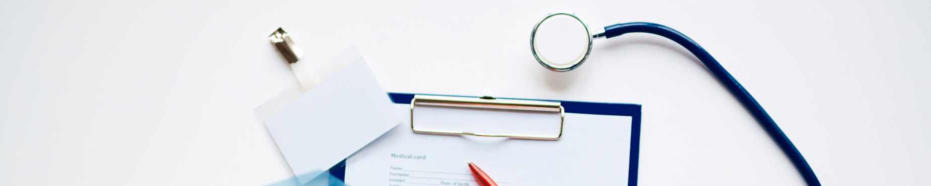 stethoscope and patient's chart and badge