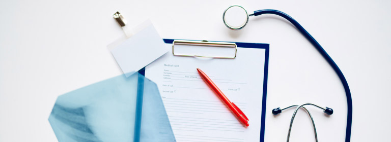 stethoscope and patient's chart and badge