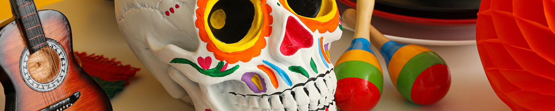 Sugar skull from La Dia de los Muertos, as well as a guitar and maracas