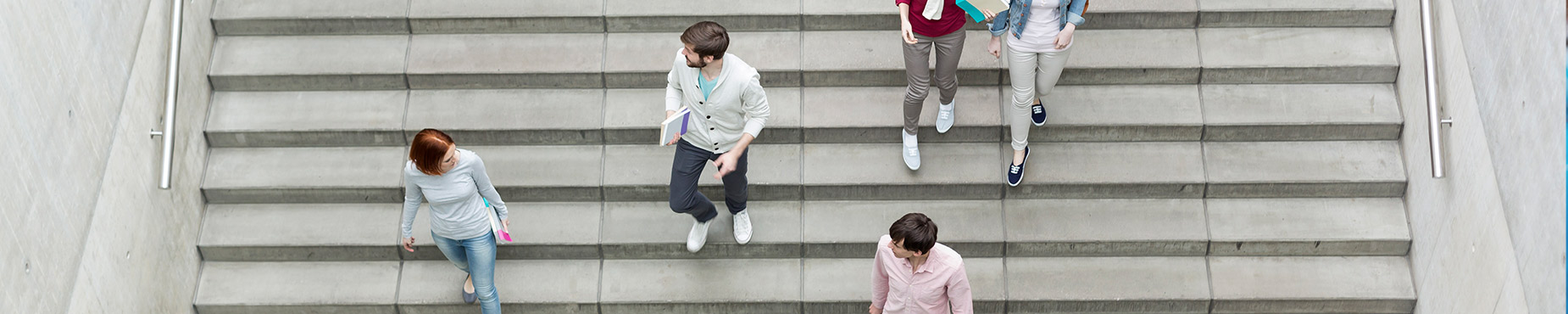 aerial shot of people walking down stairs